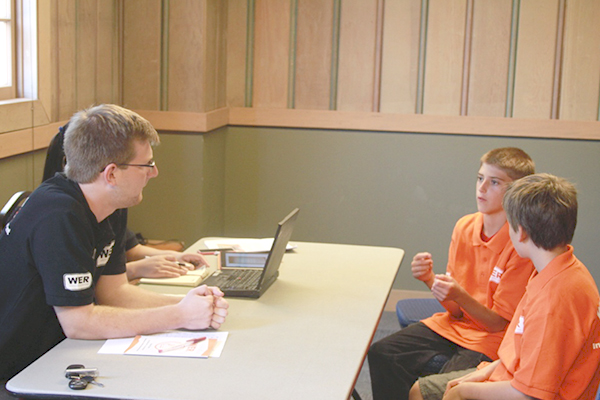 Team demonstration to the judges from China and America during the Interview session. 